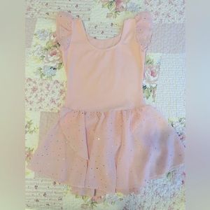 Pink  ballet leotard with rhinestones on skirt.